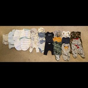 Newborn boy clothes and swaddles